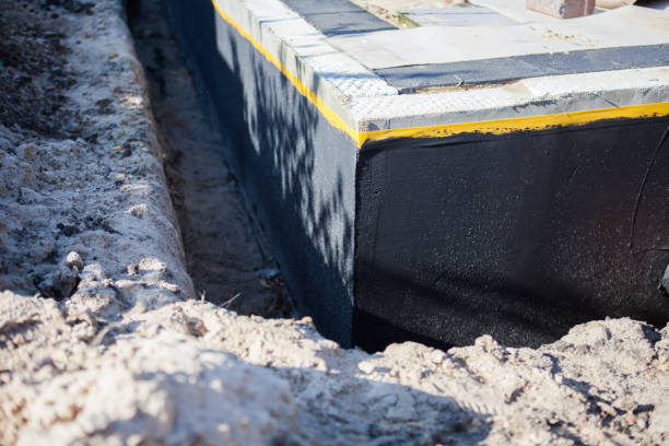 Professional Exterior Waterproofing technician working in Arlington, KS
